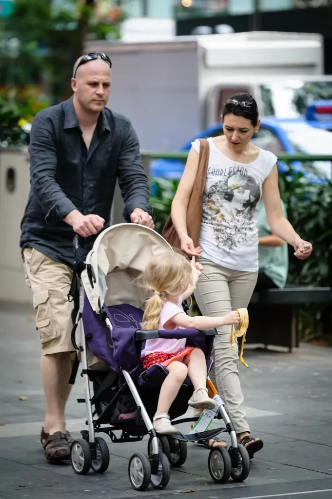 Couple with a child in pram