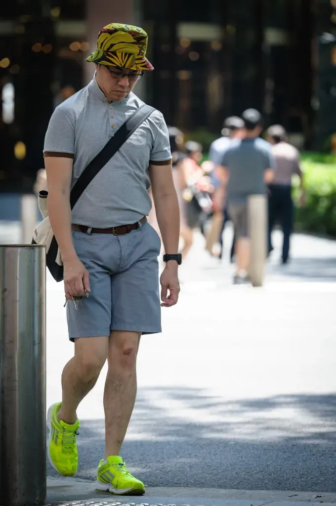 Man in grey with lime green shoes