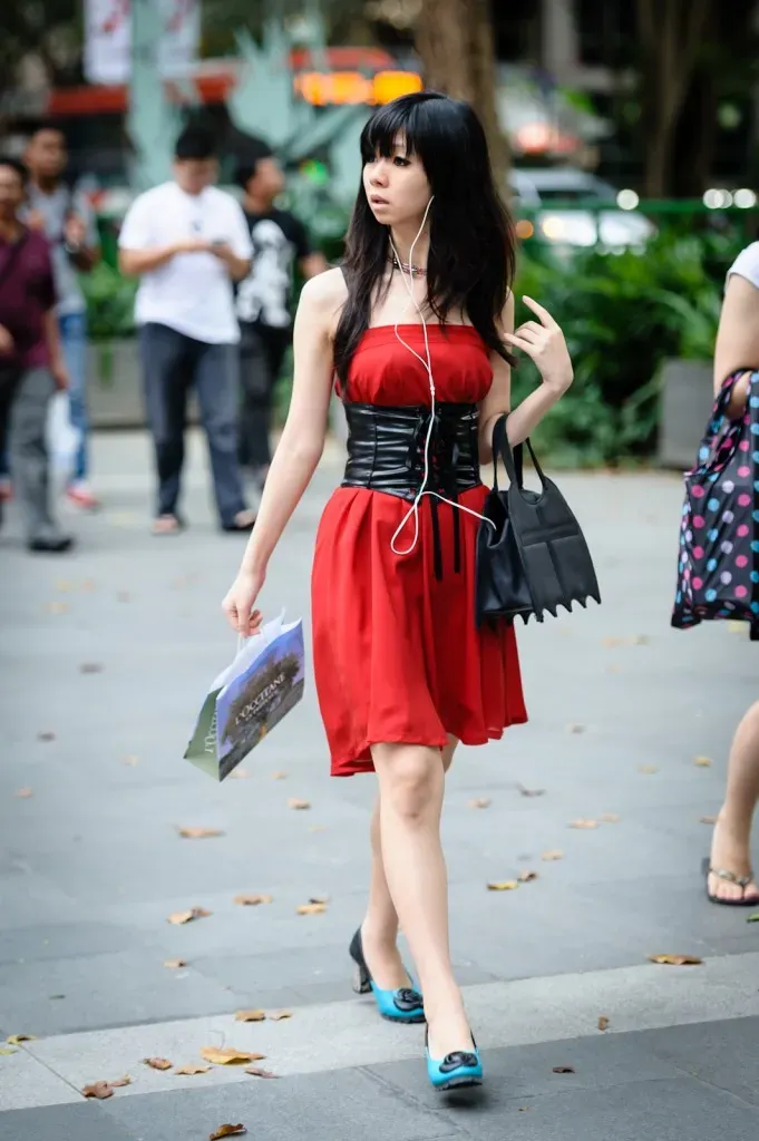 Girl in red dress and blue shoes