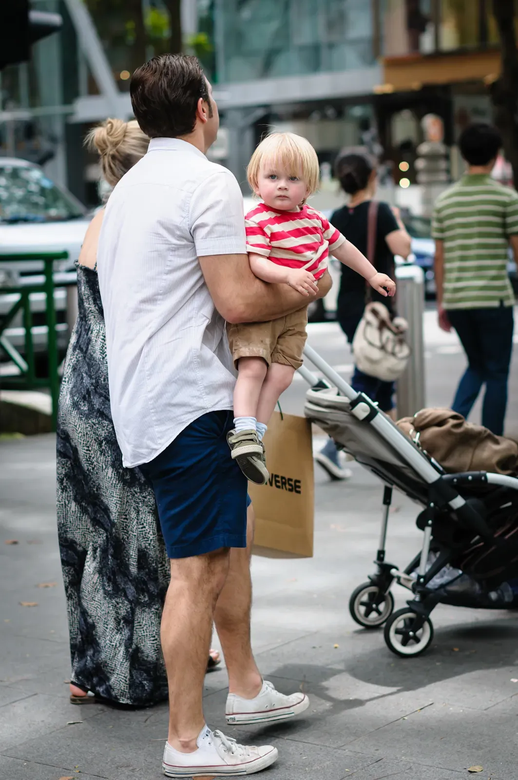 boy being carried by his father