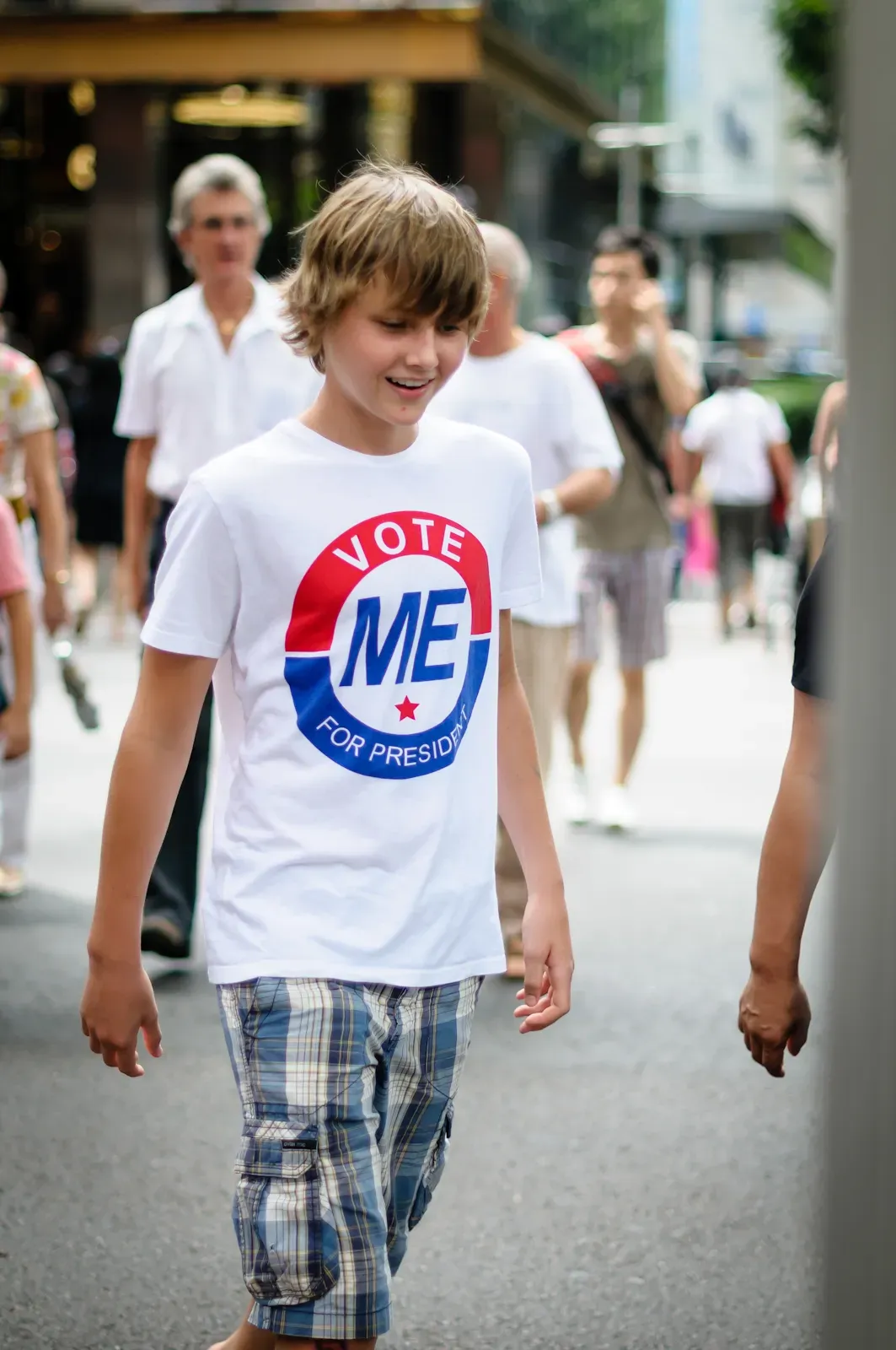 boy wearing t-shirt that says vote me for president