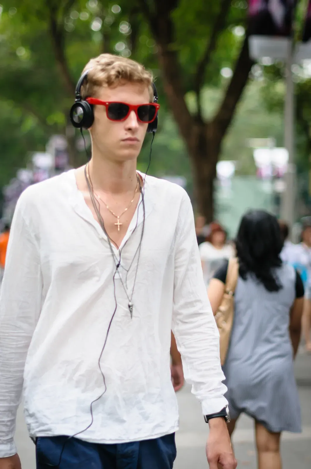 tall man wearing shades and headphones