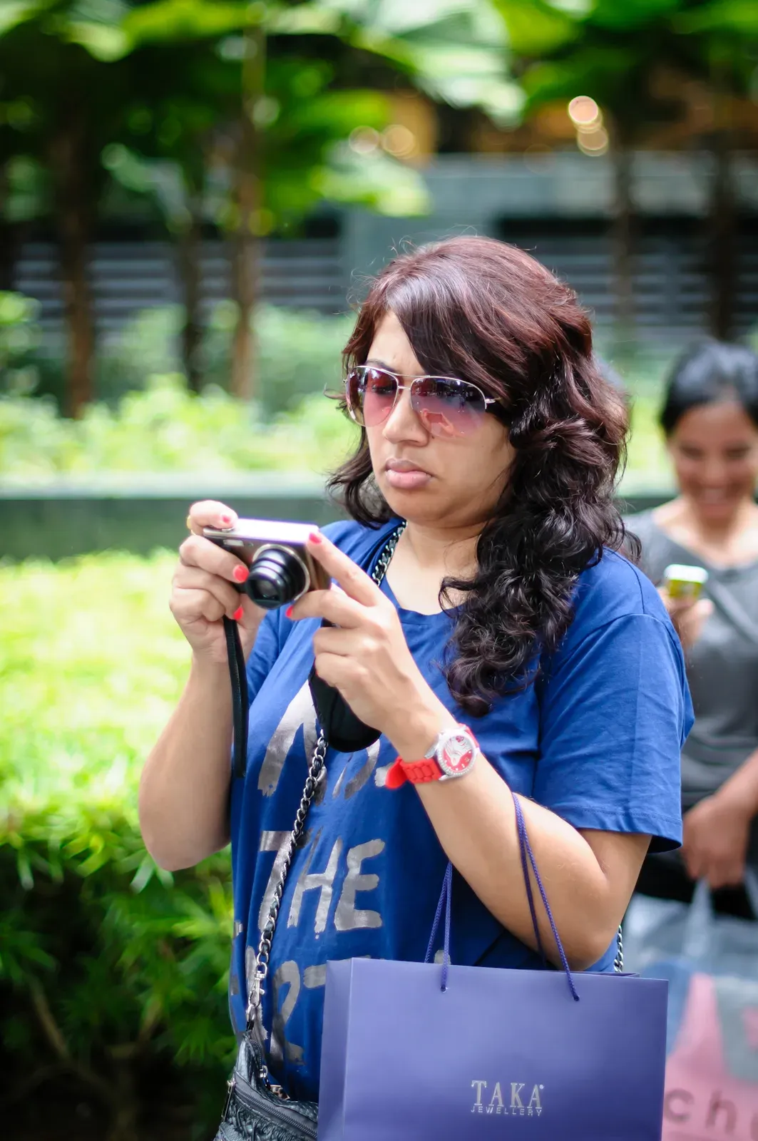 tourist looking at her camera