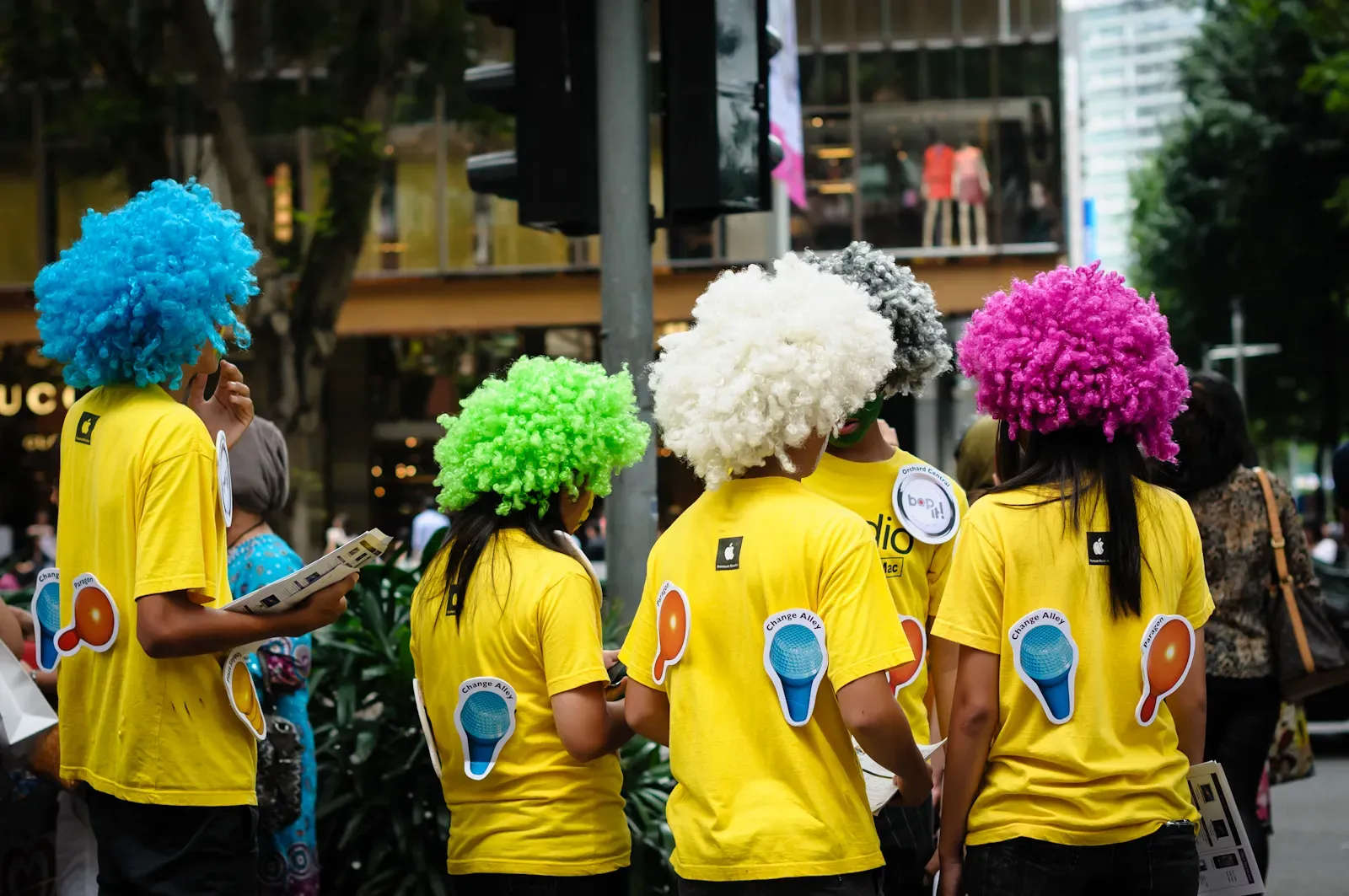 iStudio staff in colourful afro wigs