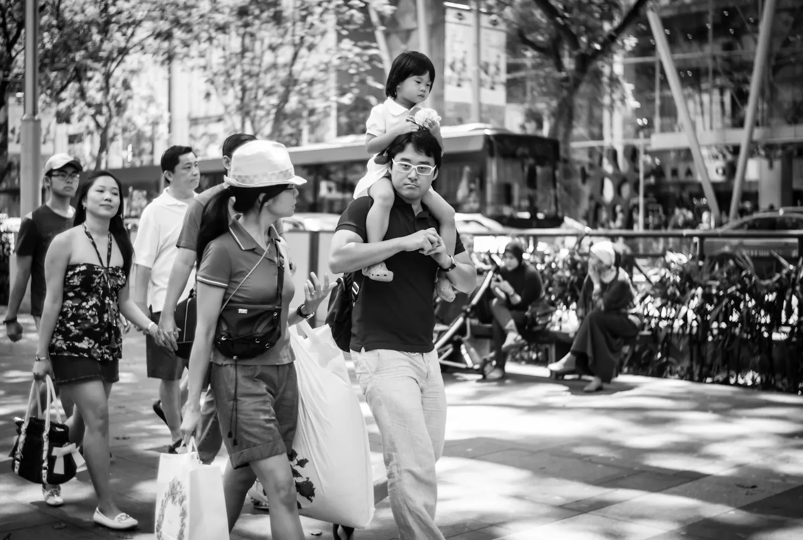 family walking along Orchard Road