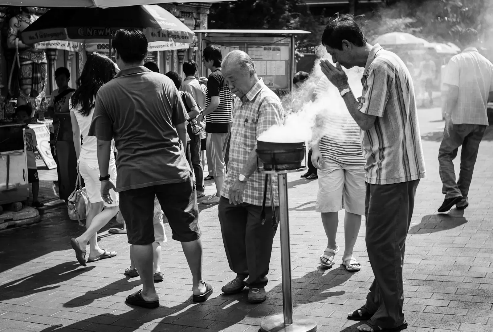 A man praying in Chinatown