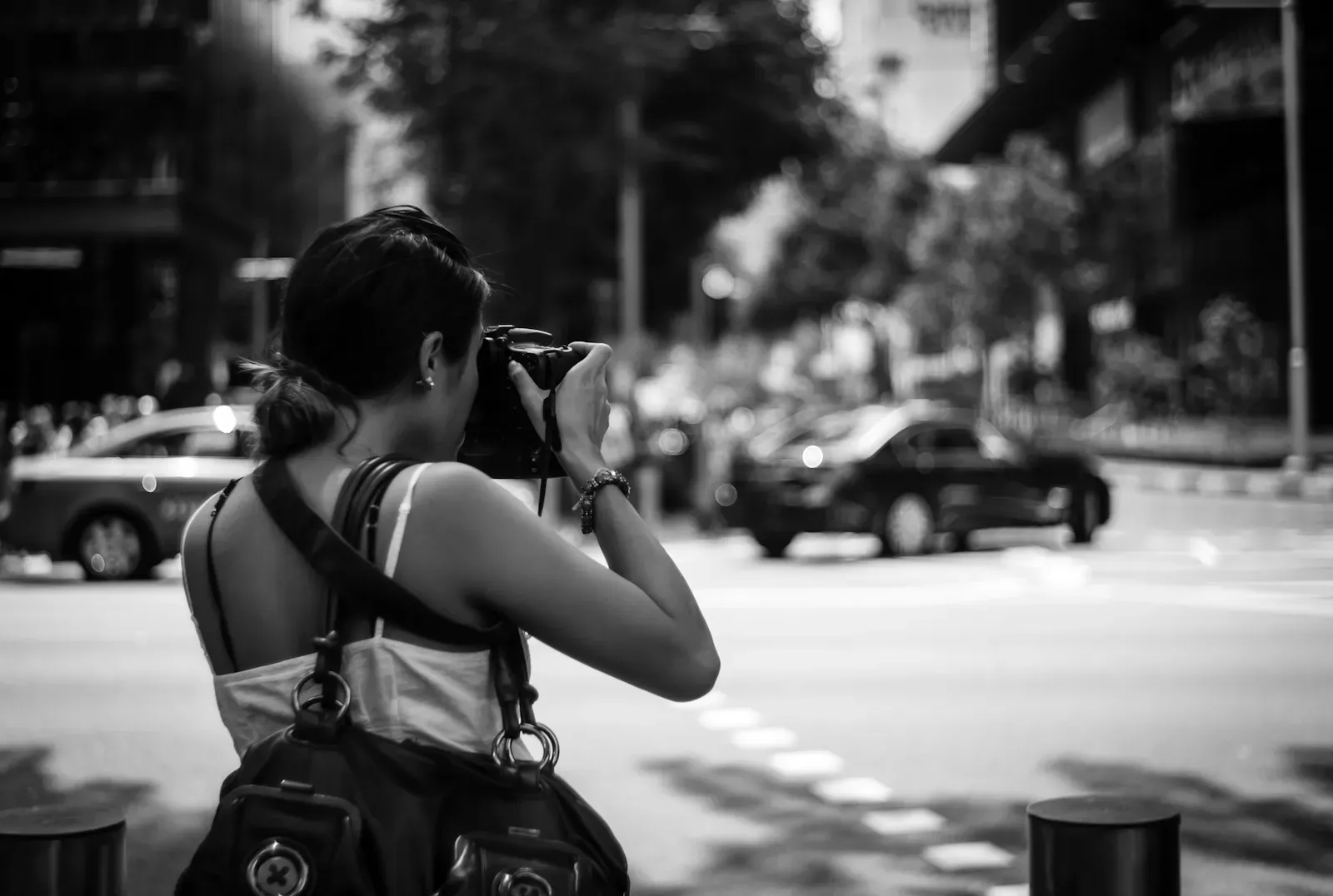 Woman shooting with a DSLR camera