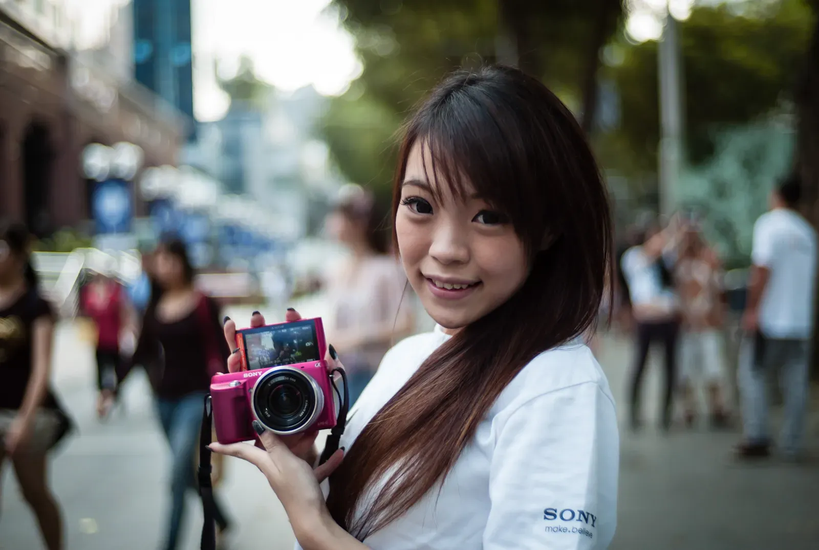 Girl promoting Sony NEX camera