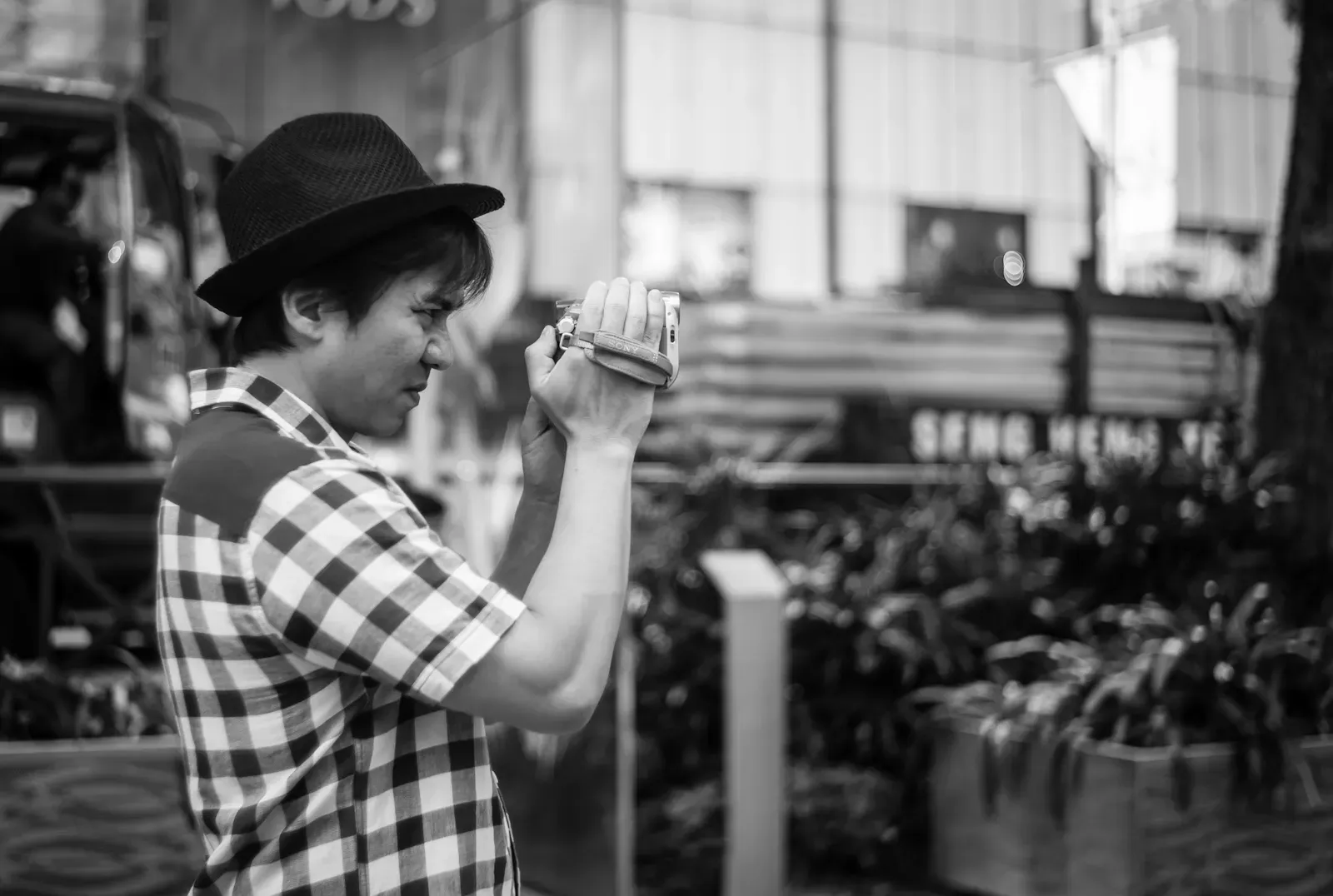 Tourist taking a video along Orchard Road