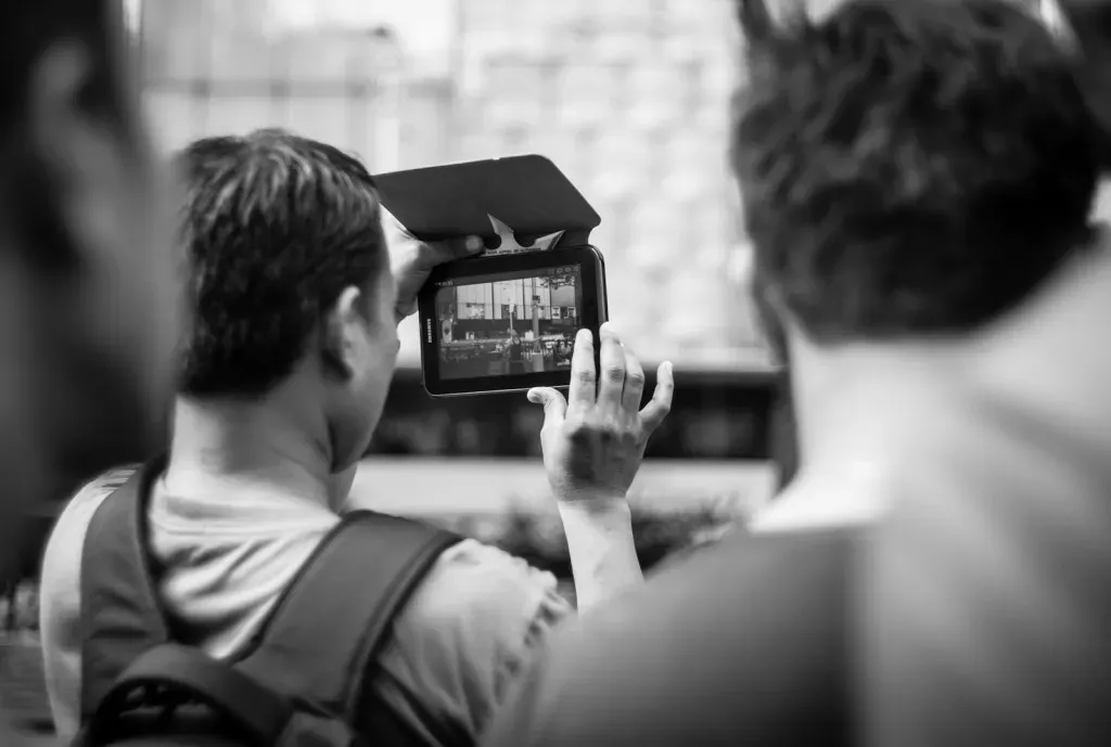 Man recording a video with his tablet