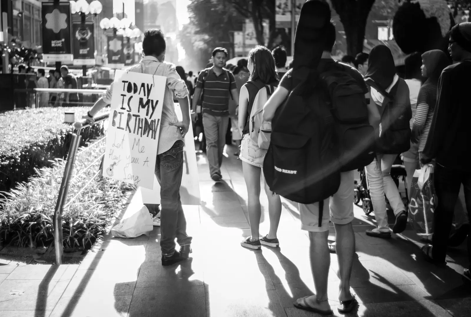 Boy with sign saying 