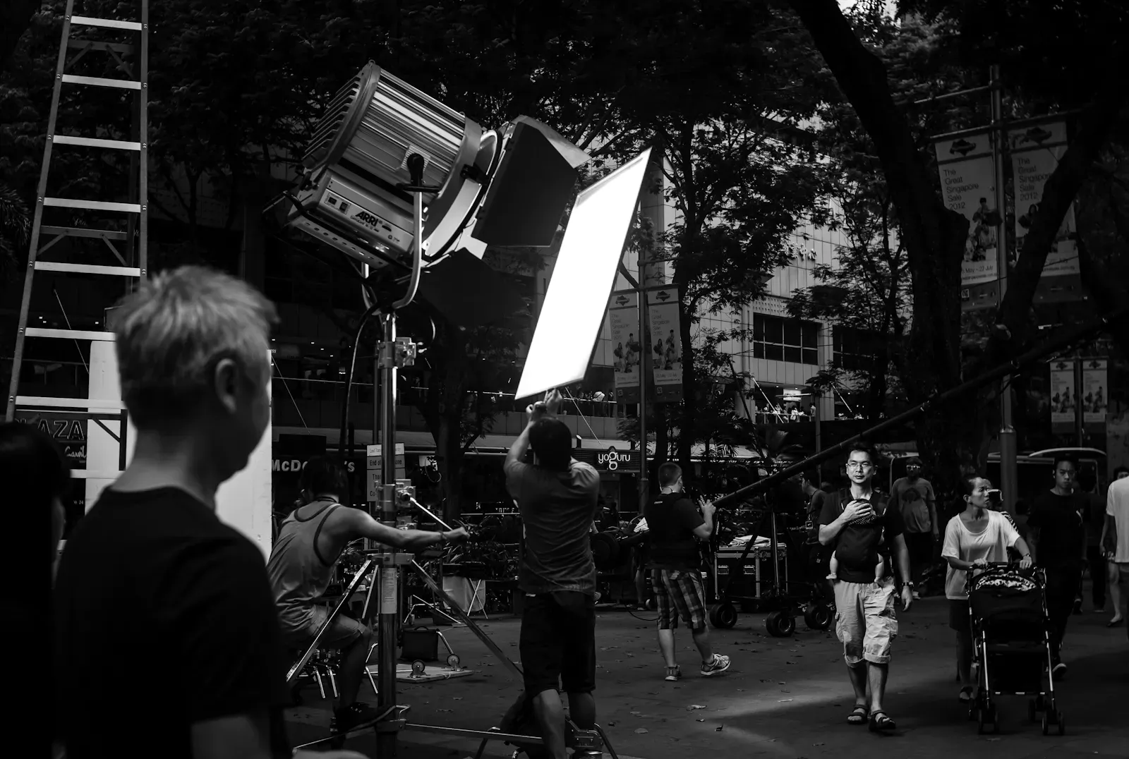 Crew setting up lighting for a fashion runway along Orchard Road