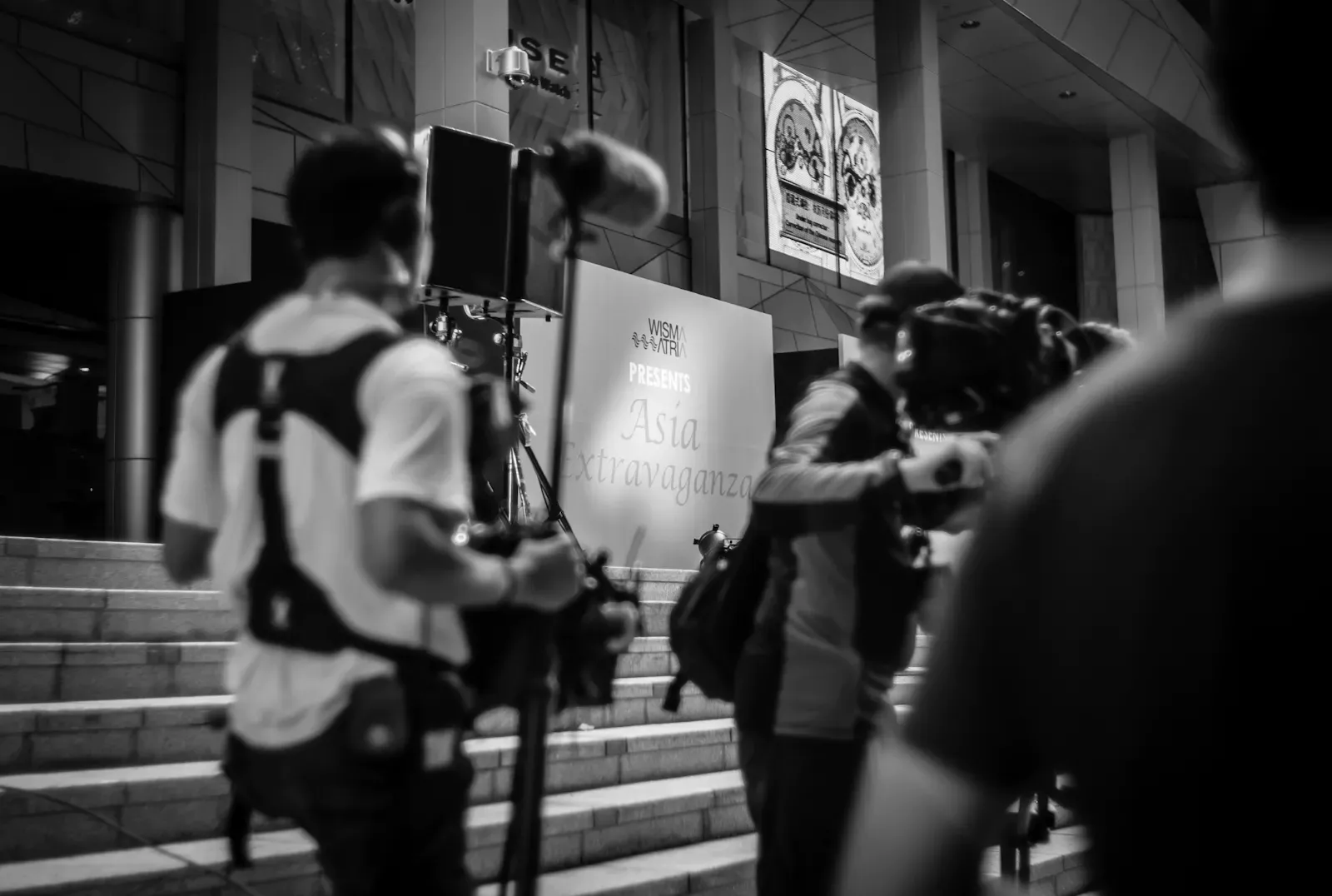 Sound man and cameraman getting ready for fashion runway along Orchard Road