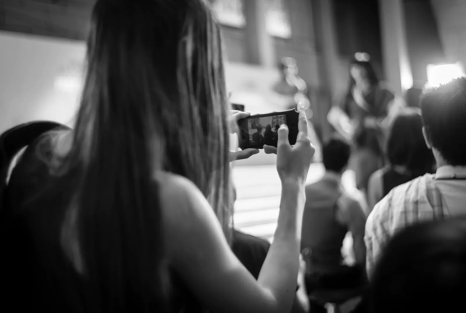 Woman recording a video with her smartphone