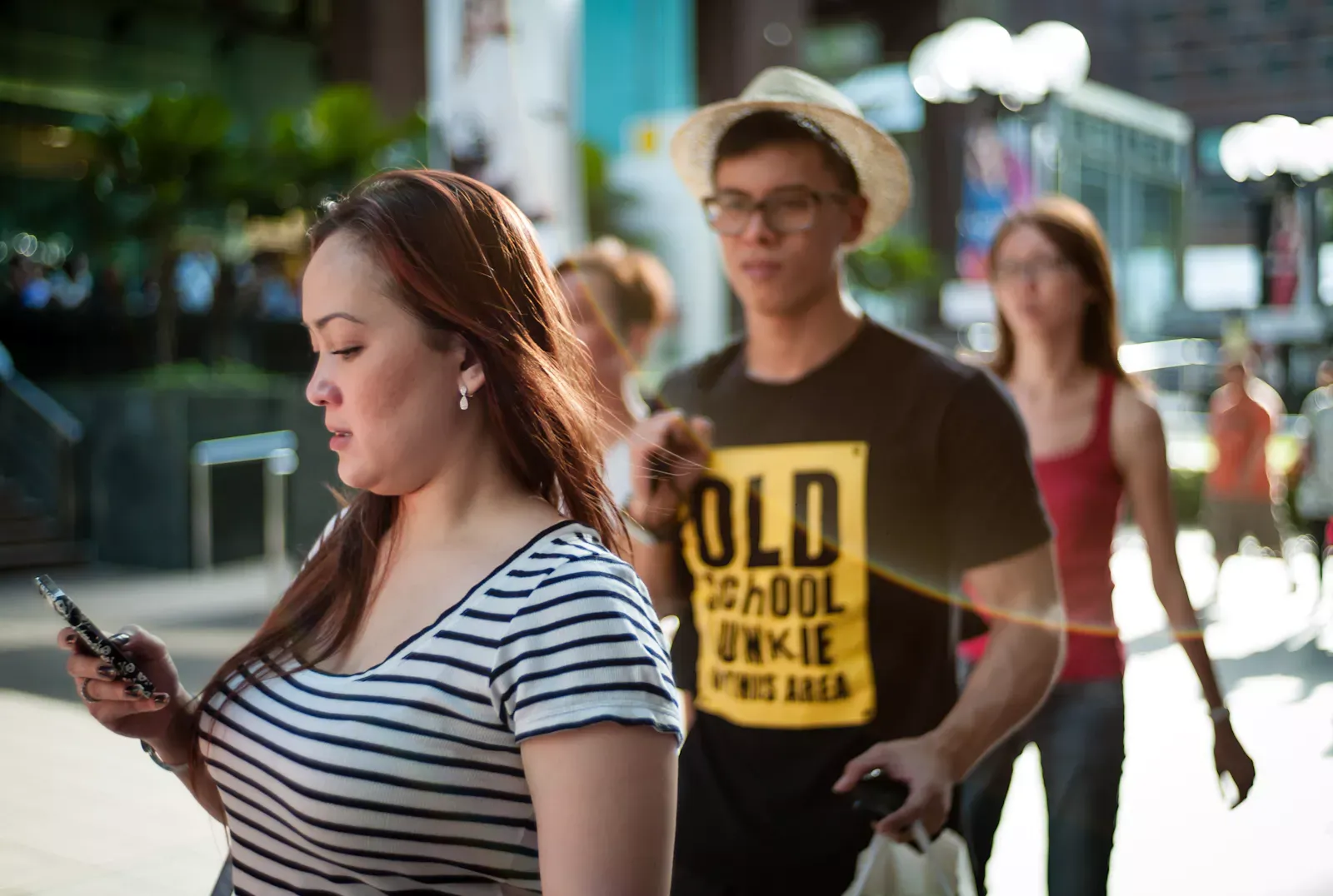 Man walking across Ray Ban advertisement