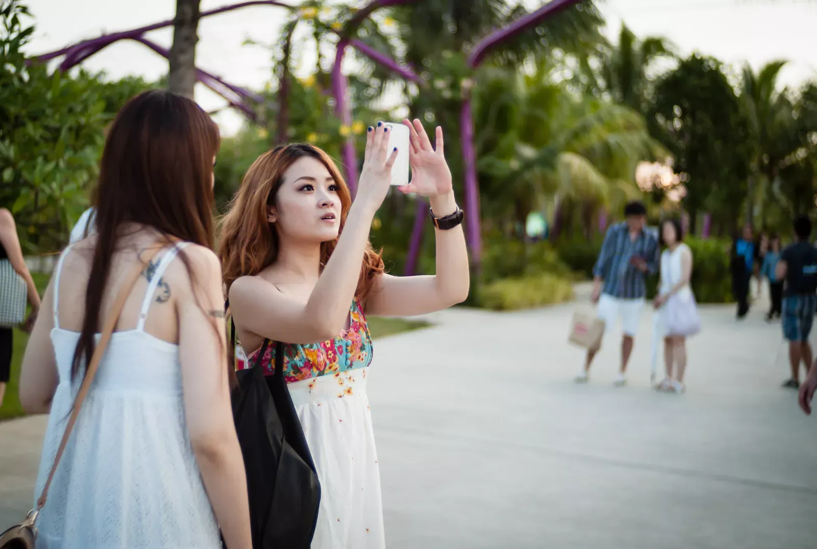 Girl taking photos with her iPhone