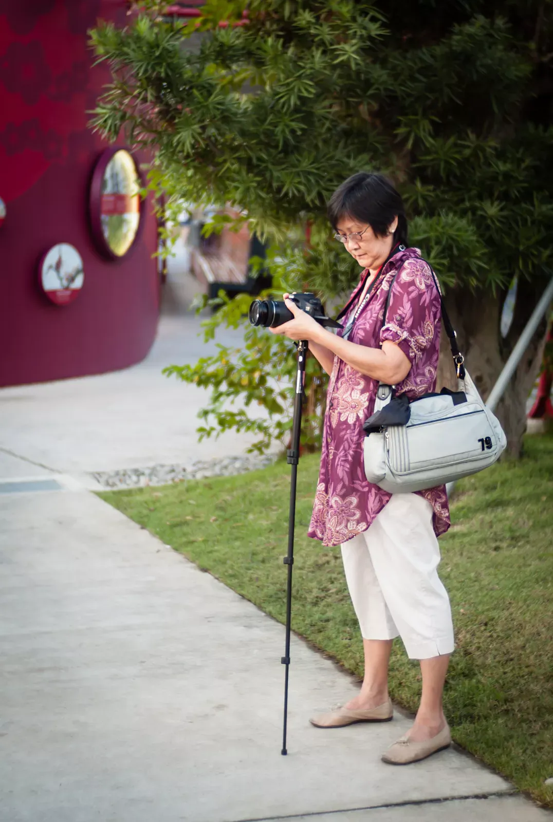 Photographer shooting using a monopod