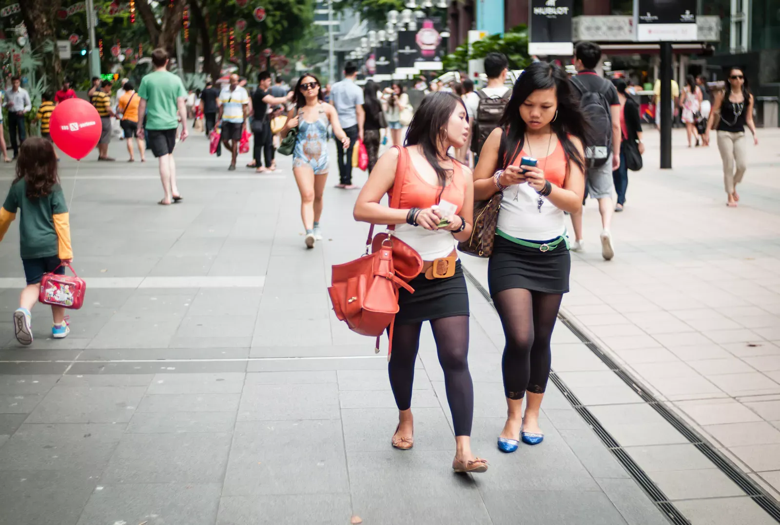 Two girls wearing matching clothing